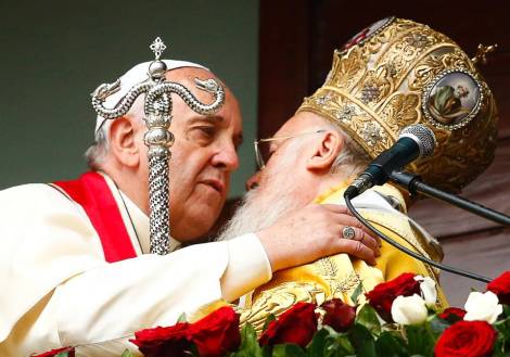 Two religious leader embrace each other, promise to bring "peace" to the Earth. 