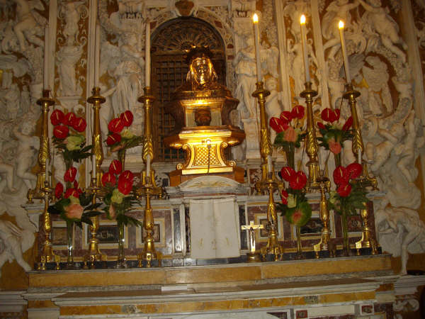 The skull is kept for adoration above the altar in a religious shrine in Italy. 
